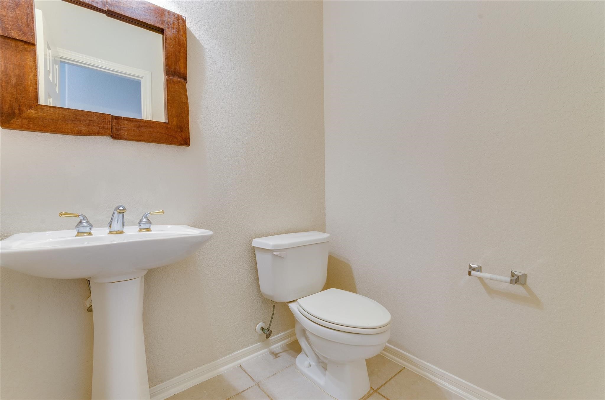4019 Angel Spring Drive Sugar Land, TX 77479 - Photo 28 of 50 a bathroom with a sink mirror and toilet