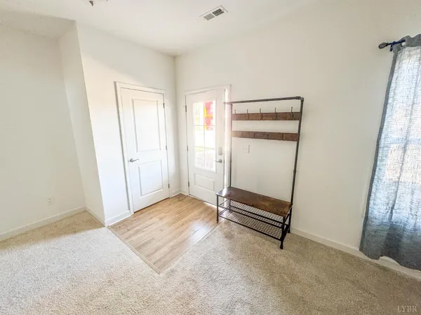 a kitchen with stainless steel appliances granite countertop a stove a sink dishwasher a refrigerator and a microwave