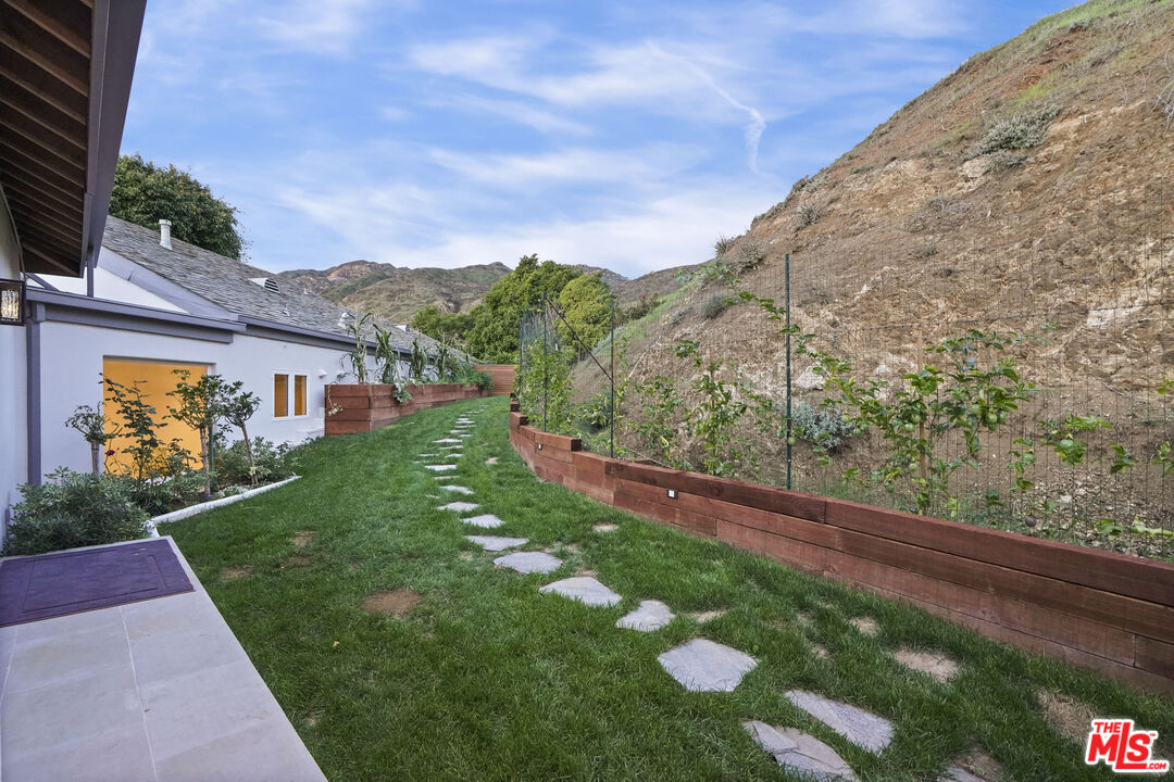 3140 Sweetwater Mesa Road Malibu, CA 90265 - Photo 67 of 71 a view of a back yard of the house