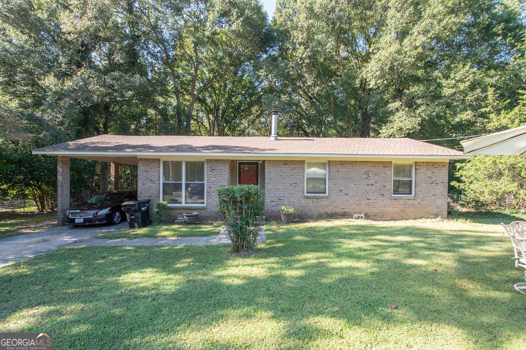 1036 Swint Road Griffin, GA 30224 - Photo 1 of 1 a view of a house with a yard and sitting area