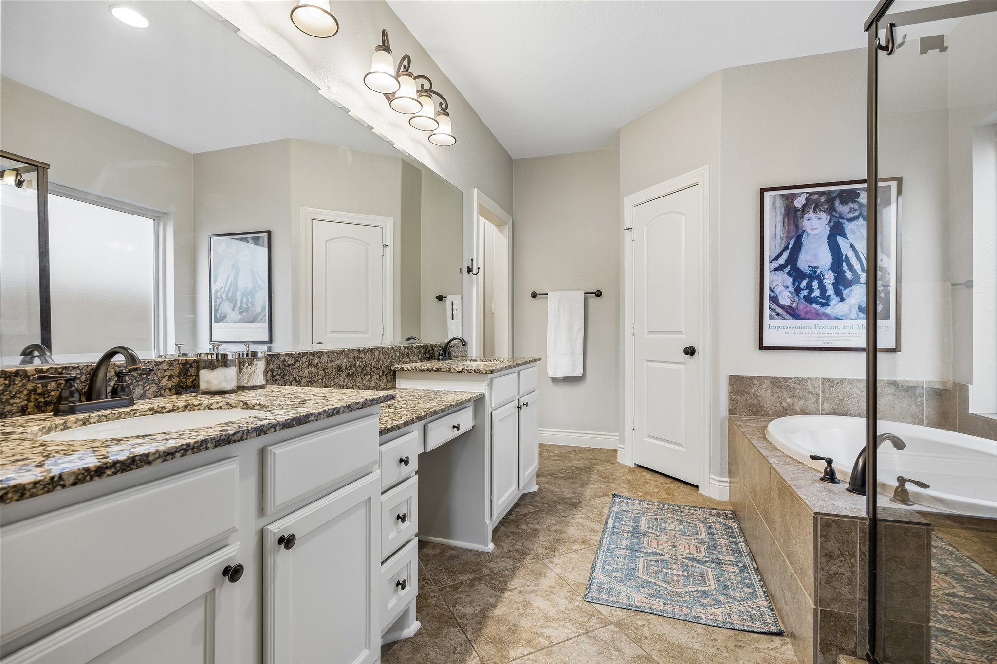 1616 Hewitt Drive Houston, TX 77018 - Photo 14 of 44 Primary bath includes dual vanities with granite countertops, abundant storage, and generous lighting.