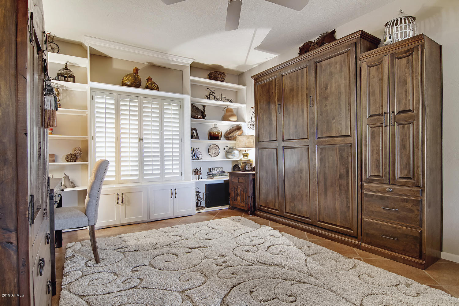19009 East Wiki Way Rio Verde, AZ 85263 - Photo 22 of 55 a kitchen with stainless steel appliances wooden floor and a refrigerator