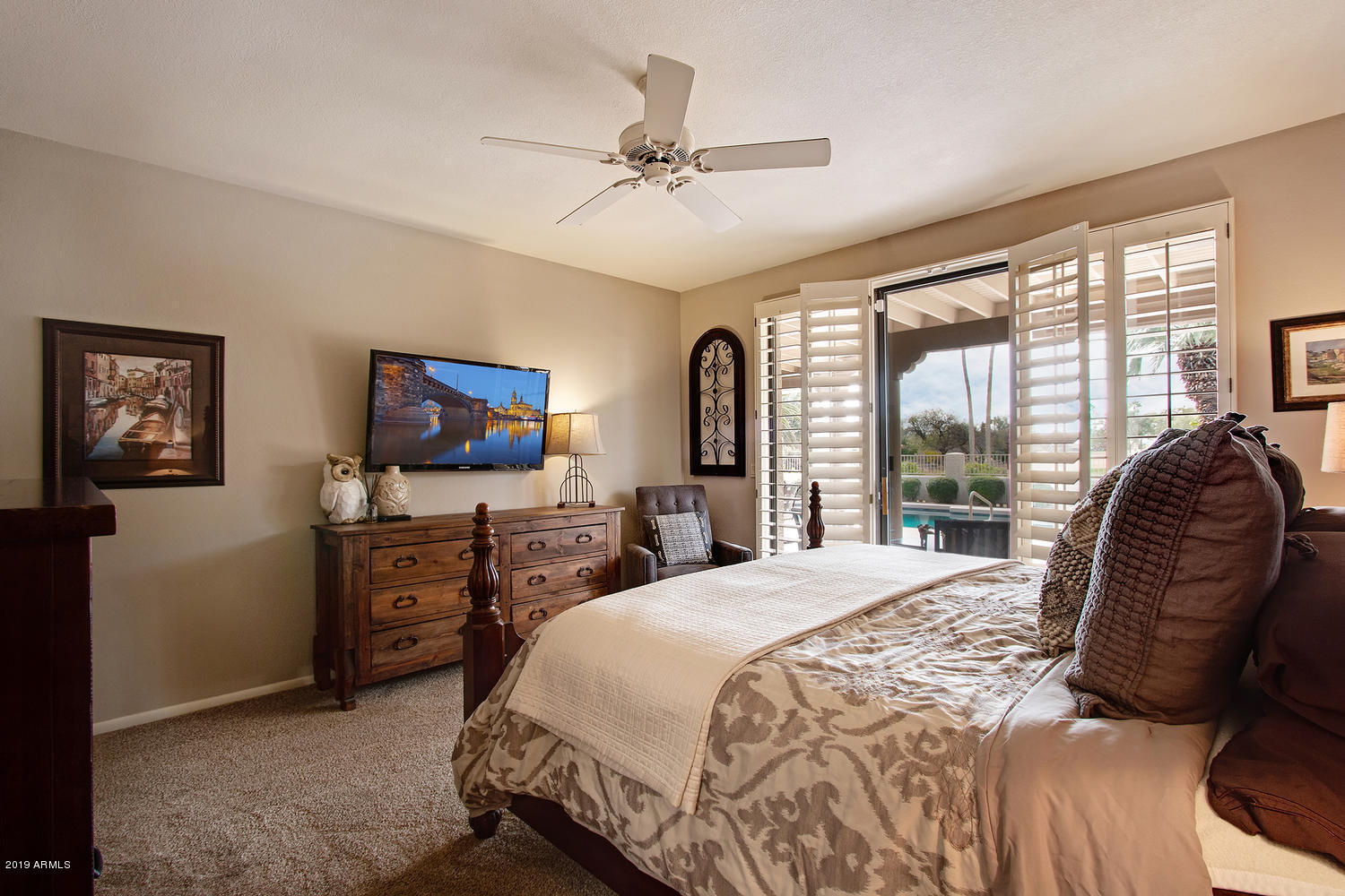 19009 East Wiki Way Rio Verde, AZ 85263 - Photo 26 of 55 a bedroom with a bed and a television