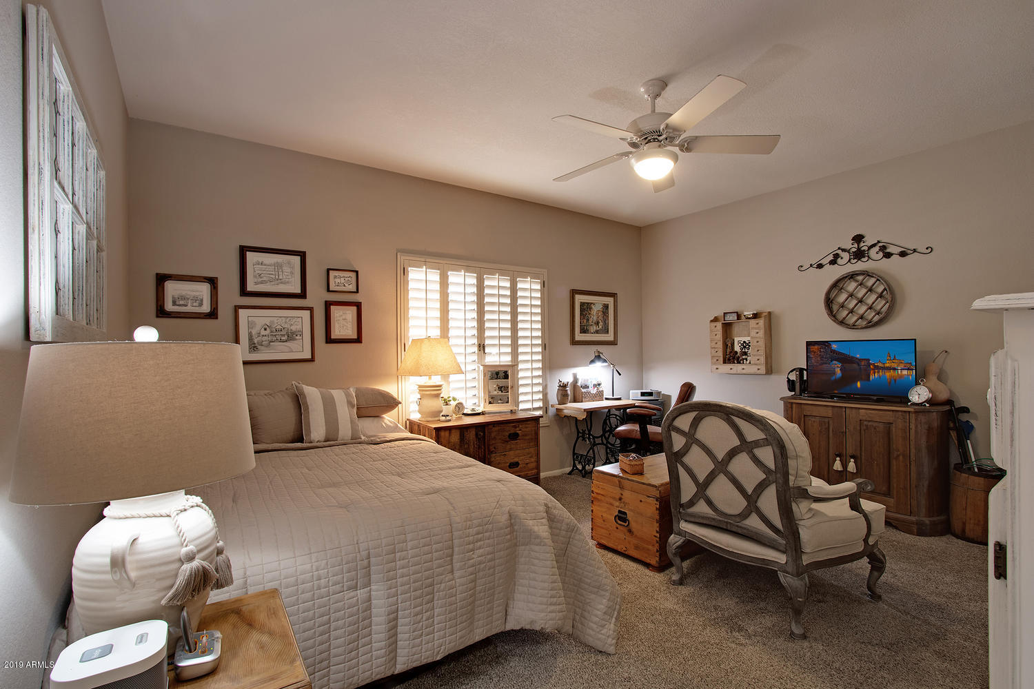 19009 East Wiki Way Rio Verde, AZ 85263 - Photo 33 of 55 a spacious bedroom with a bed and a chandelier