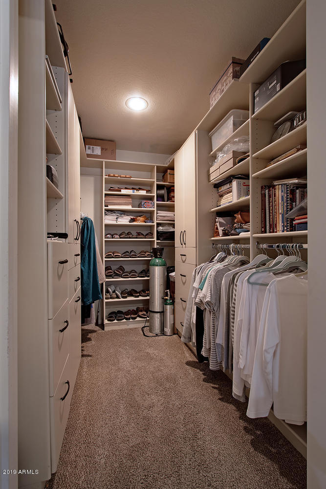 19009 East Wiki Way Rio Verde, AZ 85263 - Photo 37 of 55 a view of walk in closet with clothes and shoes
