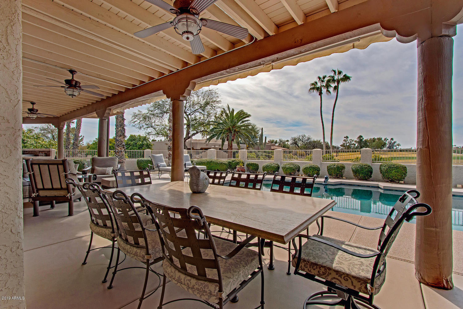 19009 East Wiki Way Rio Verde, AZ 85263 - Photo 41 of 55 a view of a chairs and table in patio with a lake view