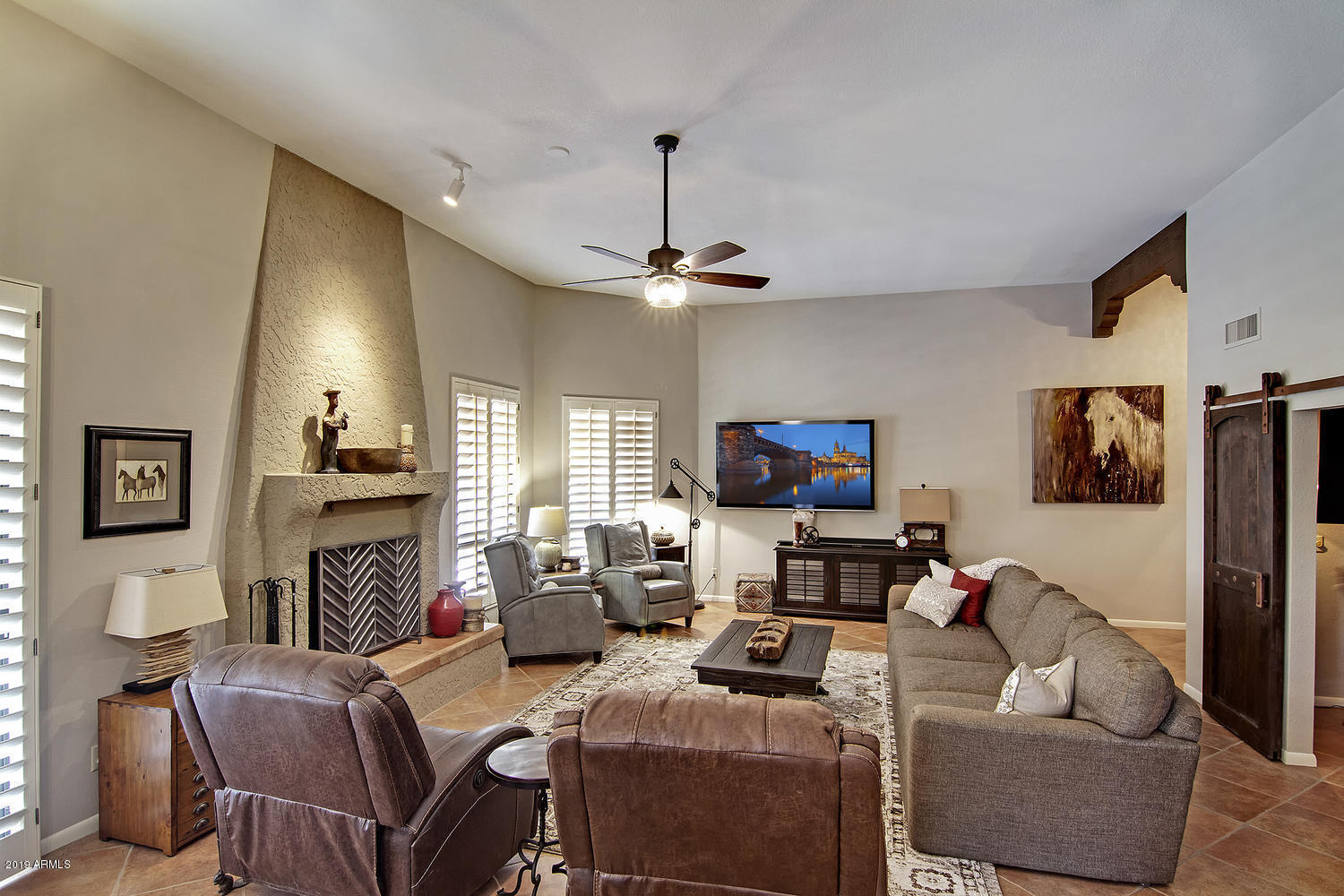 19009 East Wiki Way Rio Verde, AZ 85263 - Photo 5 of 55 a living room with fireplace furniture and a flat screen tv