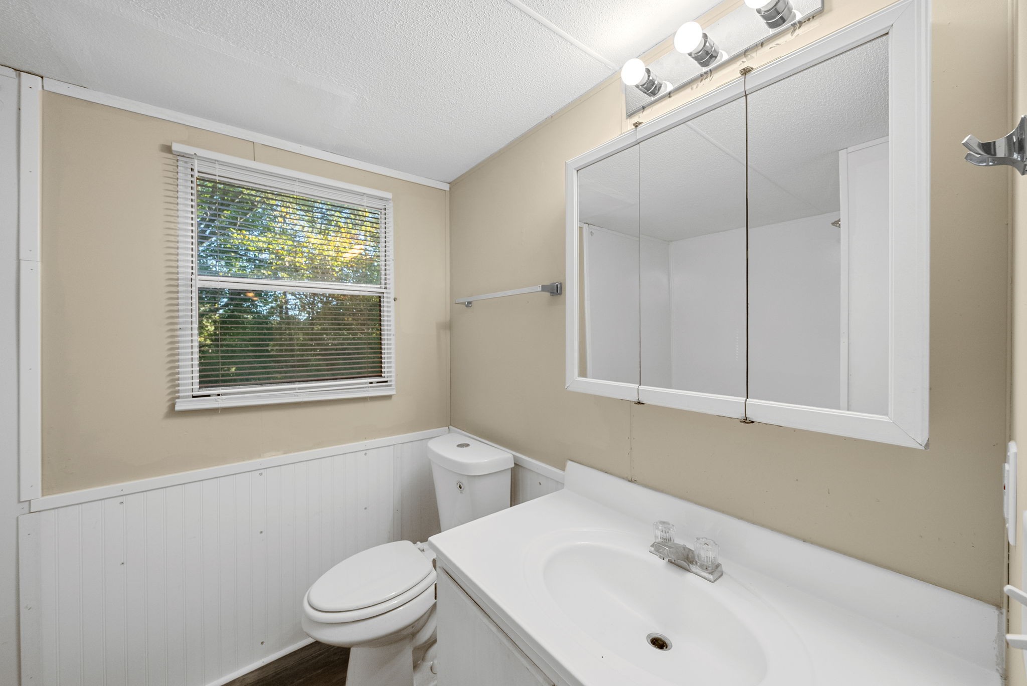 1845 Evans Road Clarksville, TN 37042 - Photo 17 of 26 a bathroom with a sink a toilet and a window
