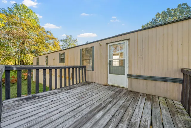 a view of wooden balcony with wooden floor and fence