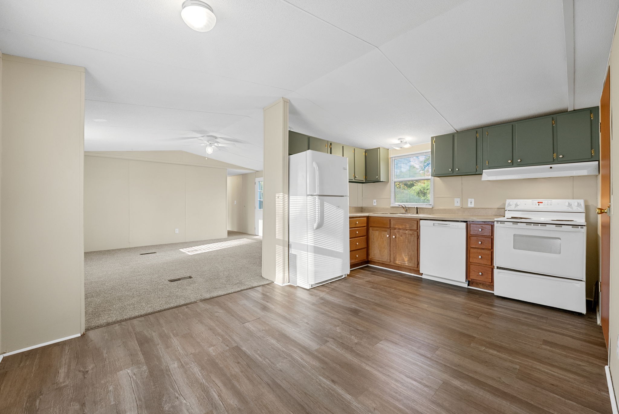 1845 Evans Road Clarksville, TN 37042 - Photo 8 of 26 a kitchen with a refrigerator and a stove top oven