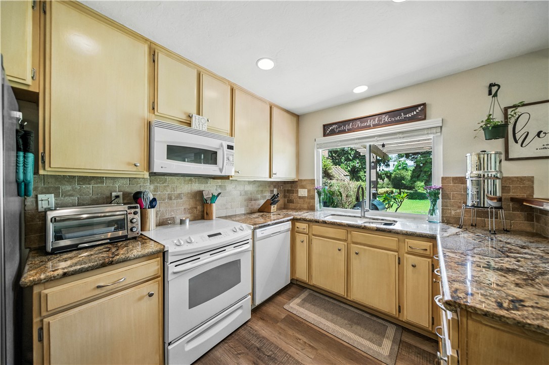 2113 David Drive Escondido, CA 92026 - Photo 13 of 46 a kitchen with a stove a sink and a microwave
