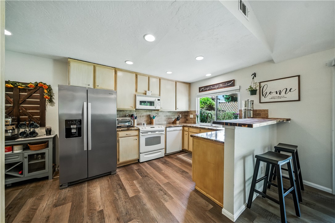 2113 David Drive Escondido, CA 92026 - Photo 15 of 46 a kitchen with cabinets a sink and stainless steel appliances