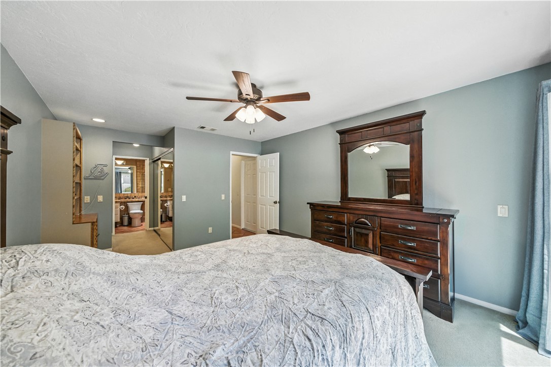 2113 David Drive Escondido, CA 92026 - Photo 23 of 46 a bedroom with a large bed and a chandelier