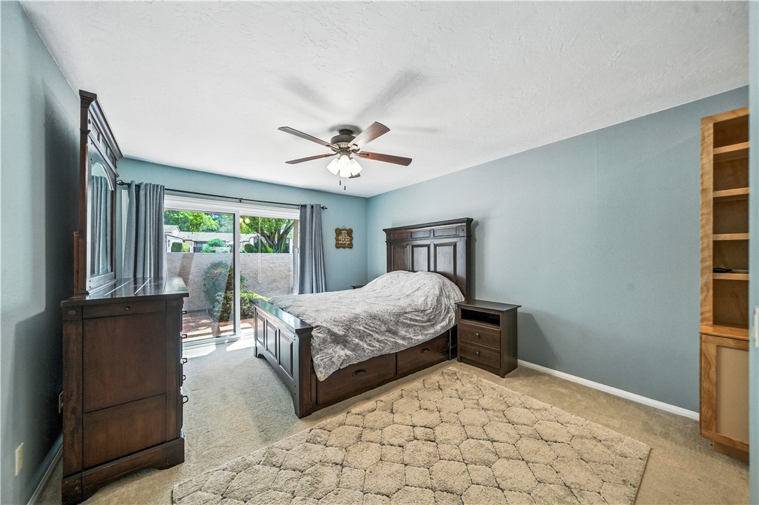 2113 David Drive Escondido, CA 92026 - Photo 24 of 46 a bedroom with a bed and a chandelier