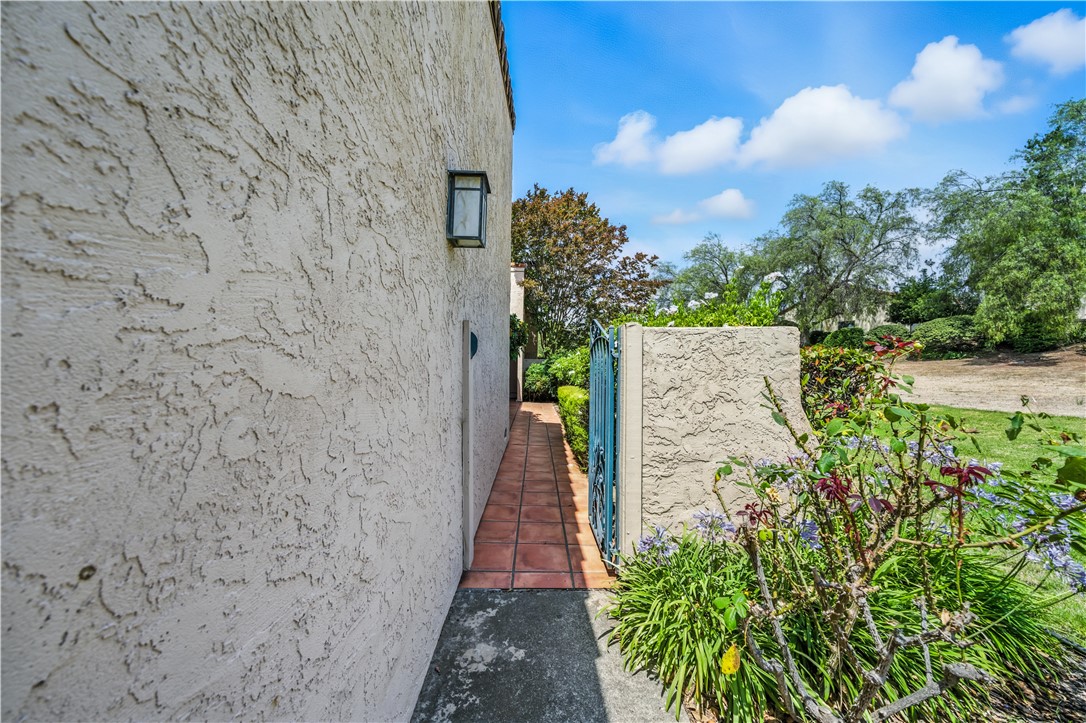 2113 David Drive Escondido, CA 92026 - Photo 39 of 46 a view of a pathway both side of brick wall