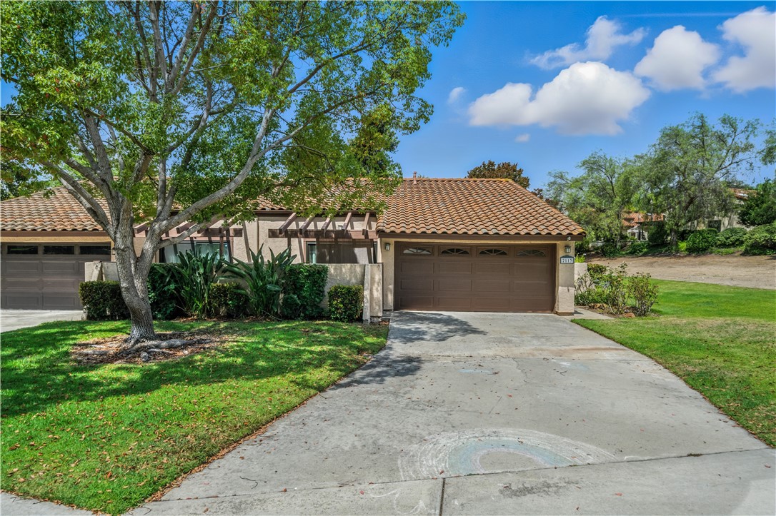 2113 David Drive Escondido, CA 92026 - Photo 42 of 46 a front view of a house with a yard and garage