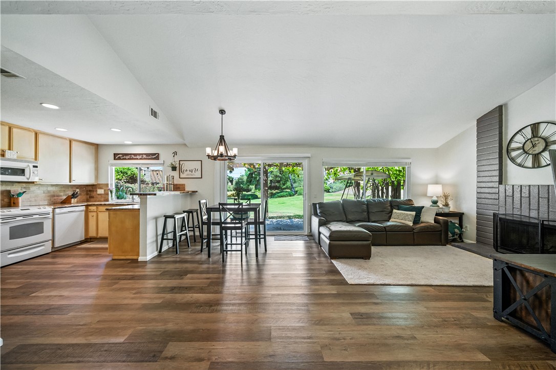 2113 David Drive Escondido, CA 92026 - Photo 10 of 46 a living room with furniture wooden floor and a fireplace