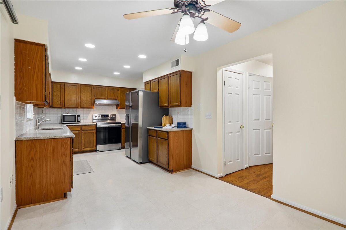 7408 Spring Tree Drive Springfield, VA 22153 - Photo 5 of 48 New SS appliances and room for eat-in-kitchen