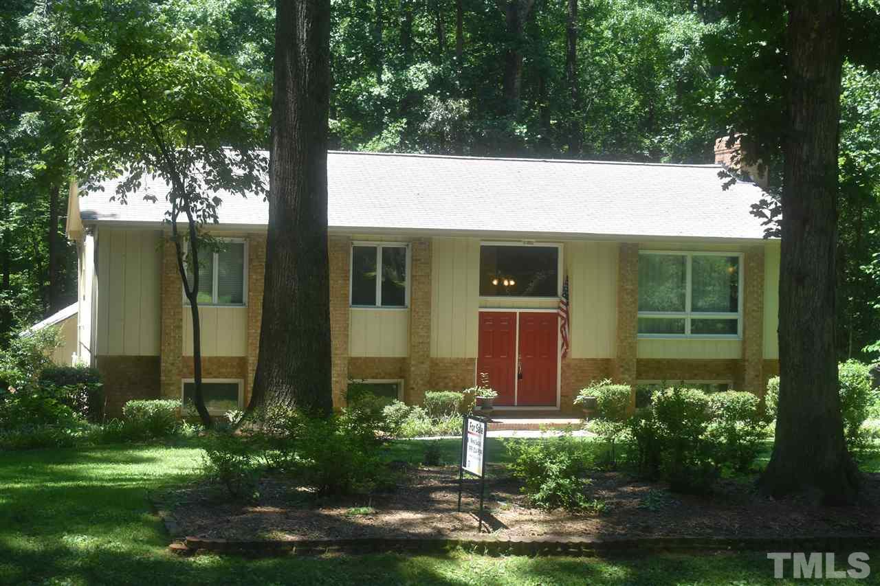 9621 Rock Creek Road Raleigh, NC 27613 - Photo 1 of 15 a house that has a tree in front of it