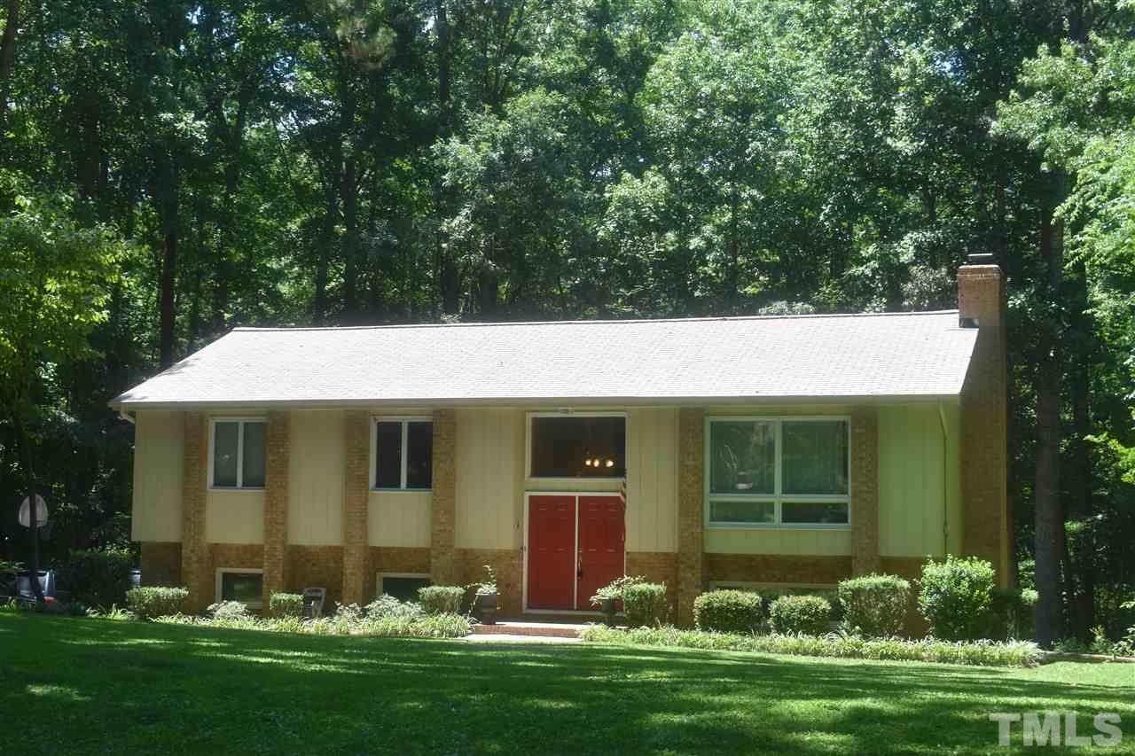 9621 Rock Creek Road Raleigh, NC 27613 - Photo 2 of 15 a front view of a house with garden