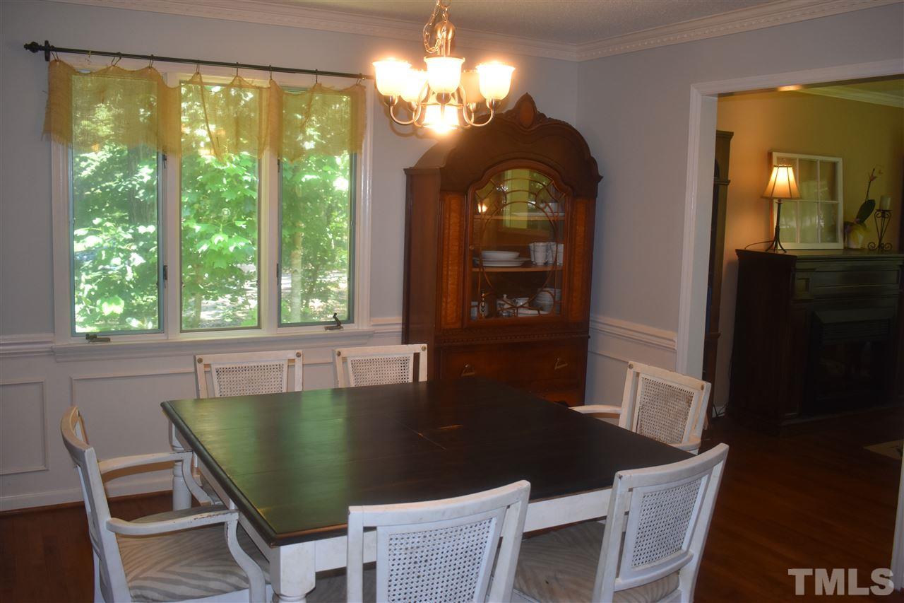 9621 Rock Creek Road Raleigh, NC 27613 - Photo 5 of 15 a view of a dining room with furniture window and outside view