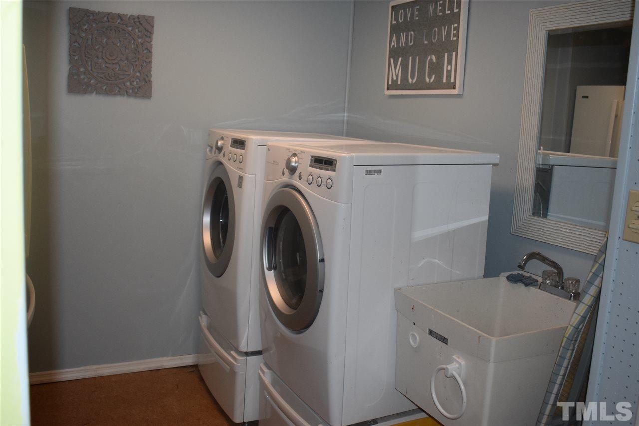 9621 Rock Creek Road Raleigh, NC 27613 - Photo 9 of 15 a utility room with dryer and washer
