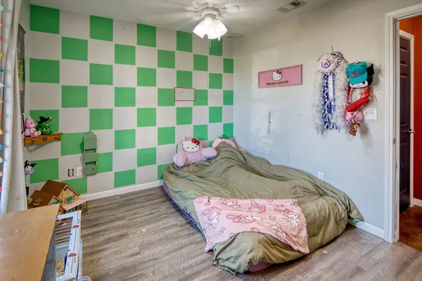 a bedroom with a bed and a dresser