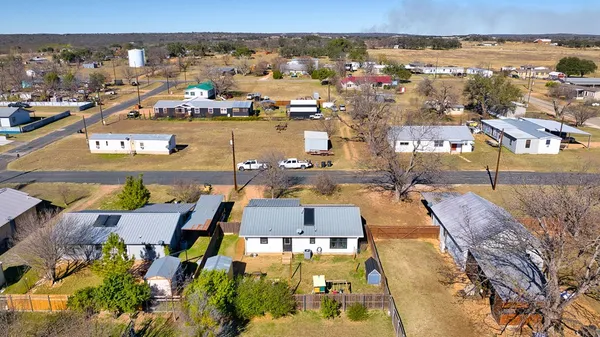 an aerial view of residential building with parking