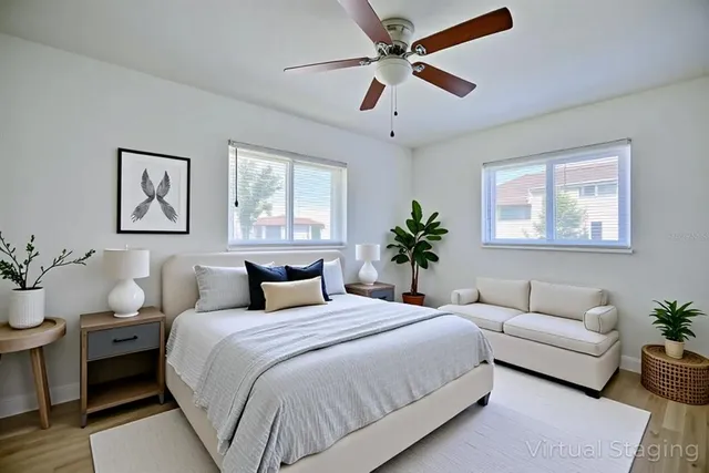 a bedroom with a large bed and a couch