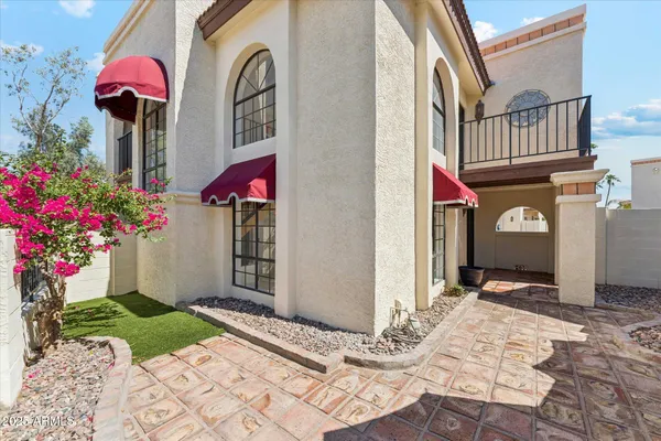 a view of swimming pool with outdoor seating and plants