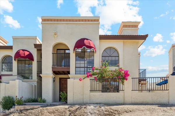 a view of a potted plants next to a wall