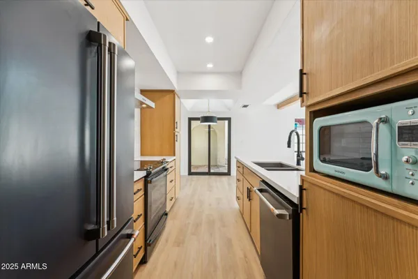 a bathroom with a sink a mirror and a shower