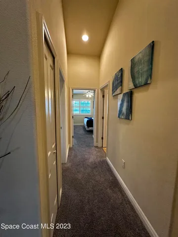 a view of hallway with livingroom