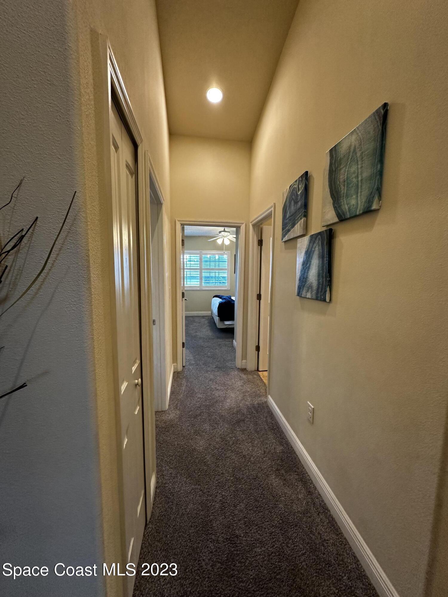 103 Parrotfish Lane, Unit 101 Merritt Island, FL 32953 - Photo 13 of 19 a view of hallway with livingroom