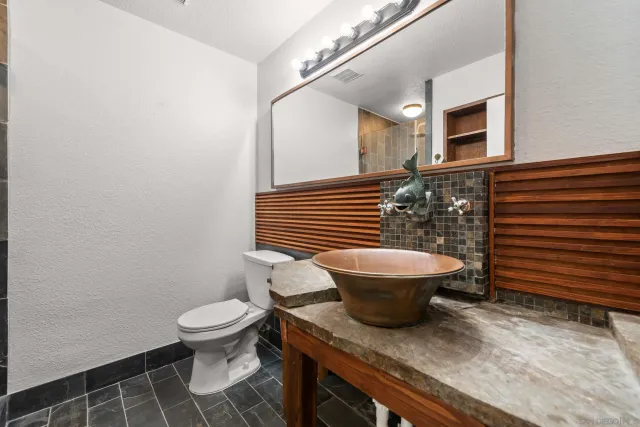a view of bathroom with a toilet and a shower