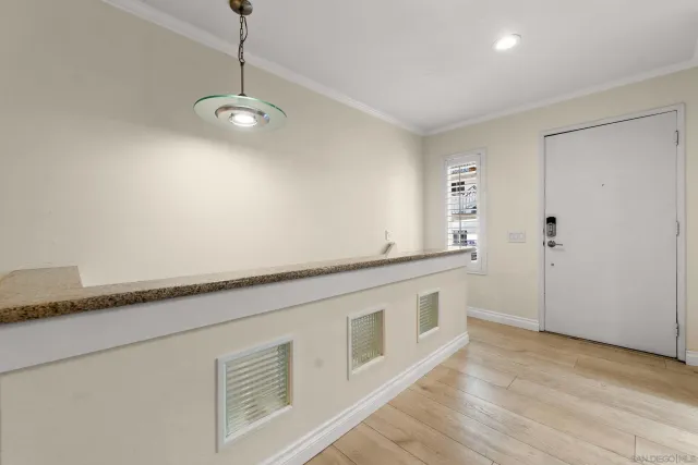 a view of a kitchen with a sink and dishwasher