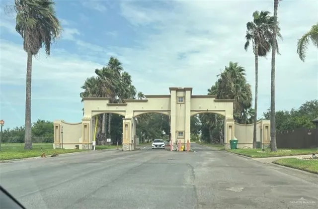 a view of a street with a building in the background