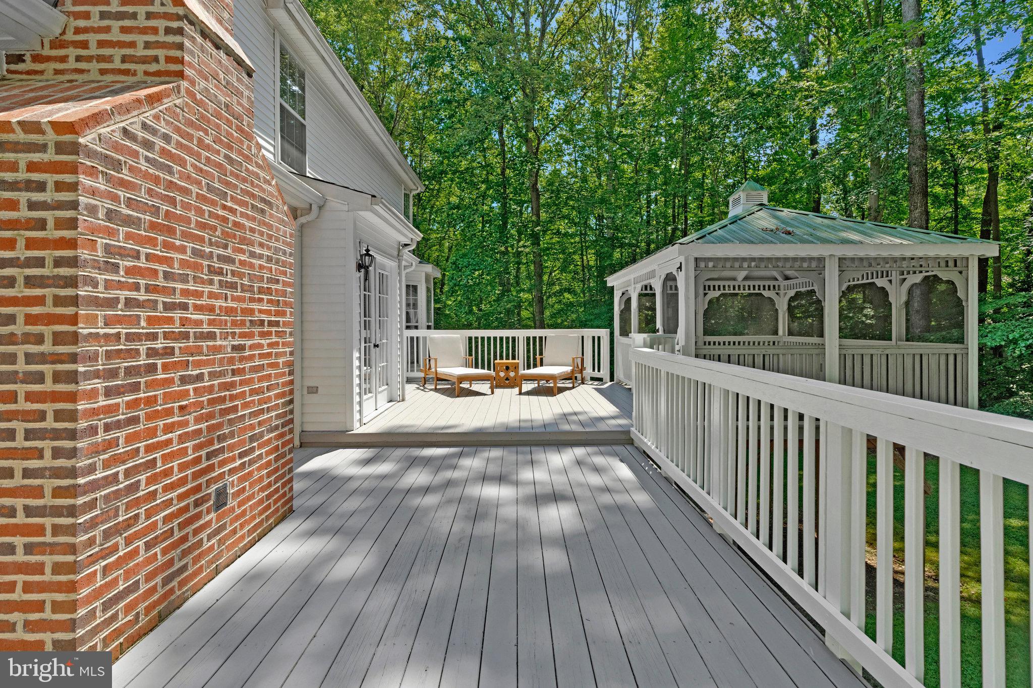 6265 Happy Creek Road Manassas, VA 20112 - Photo 43 of 50 Serene deck overlooking lush greenery.