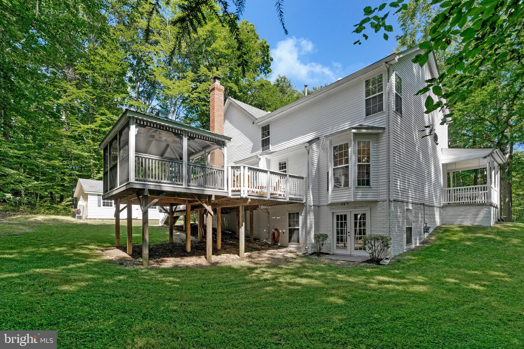 6265 Happy Creek Road Manassas, VA 20112 - Photo 47 of 50 Charming home nestled in lush greenery.