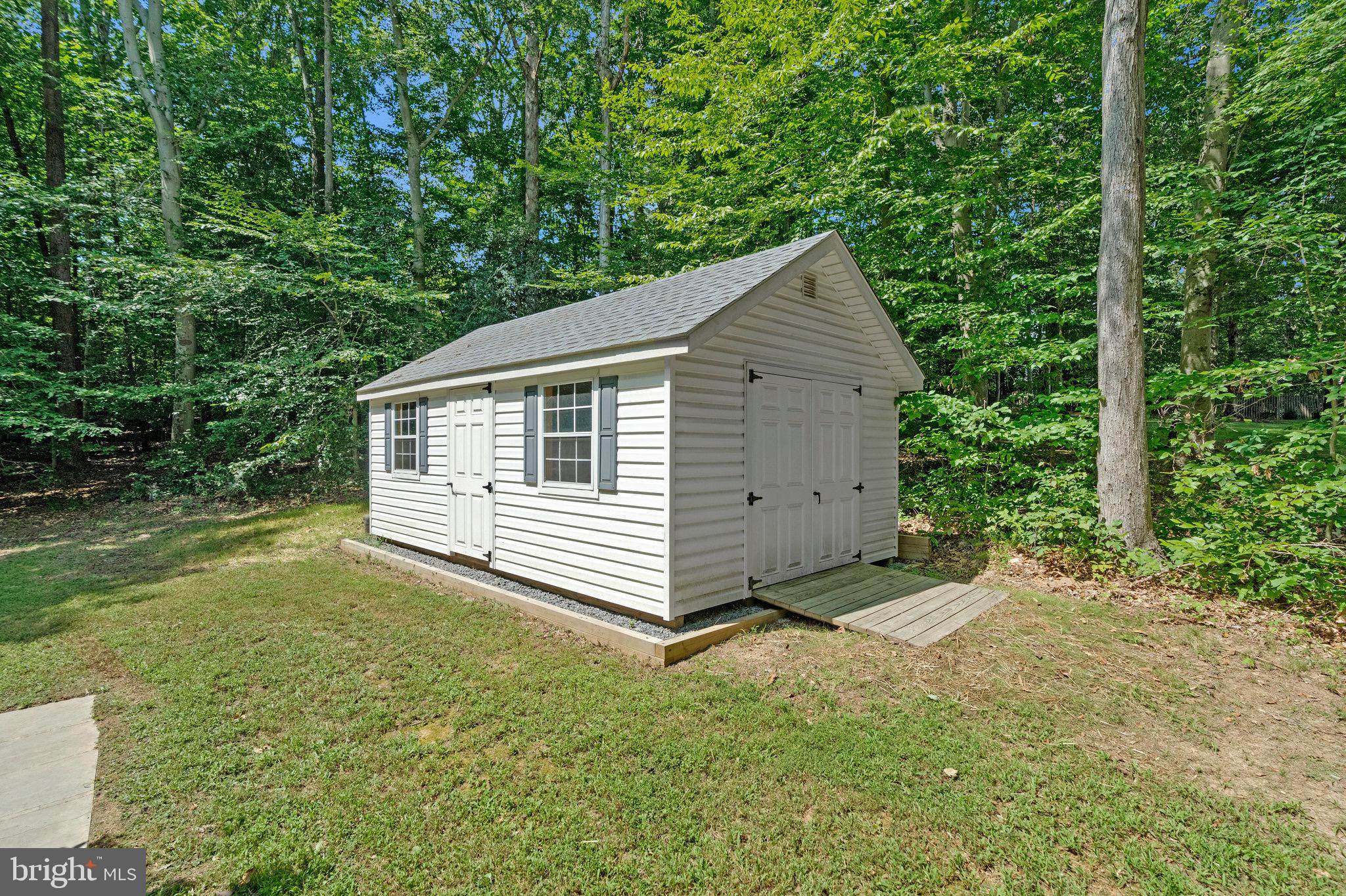 6265 Happy Creek Road Manassas, VA 20112 - Photo 49 of 50 12x20 shed nestled in a lush forest.