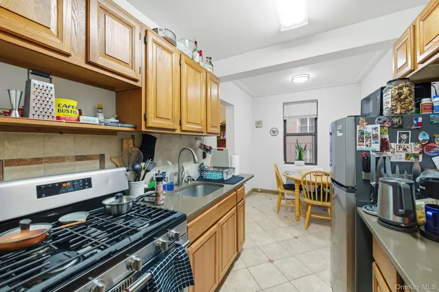 a kitchen with stainless steel appliances granite countertop a stove and a sink