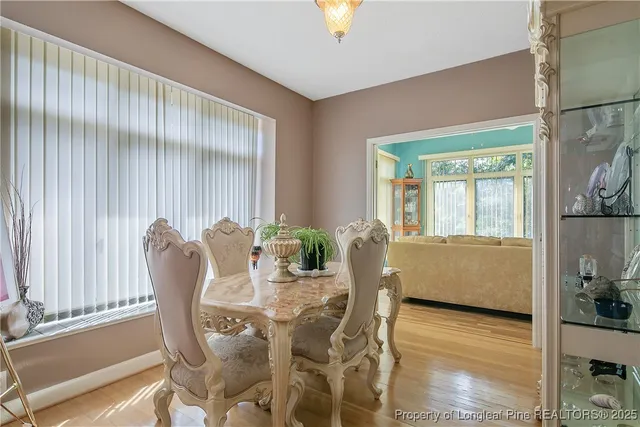 a dining room with furniture and window