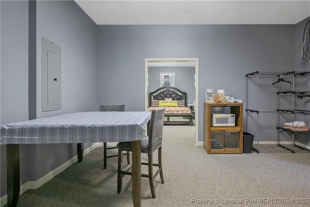 a dining room with a table and chairs