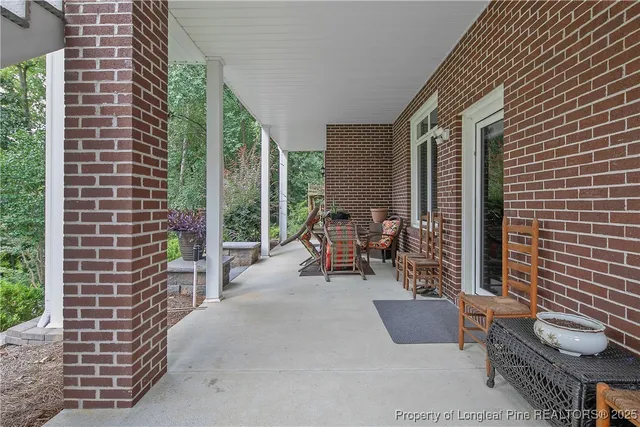 a view of roof deck with outdoor seating and city view