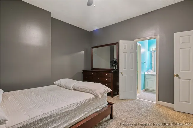 a bedroom with a bed and a cabinets