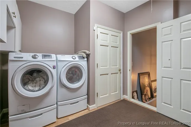 a utility room with dryer and washer