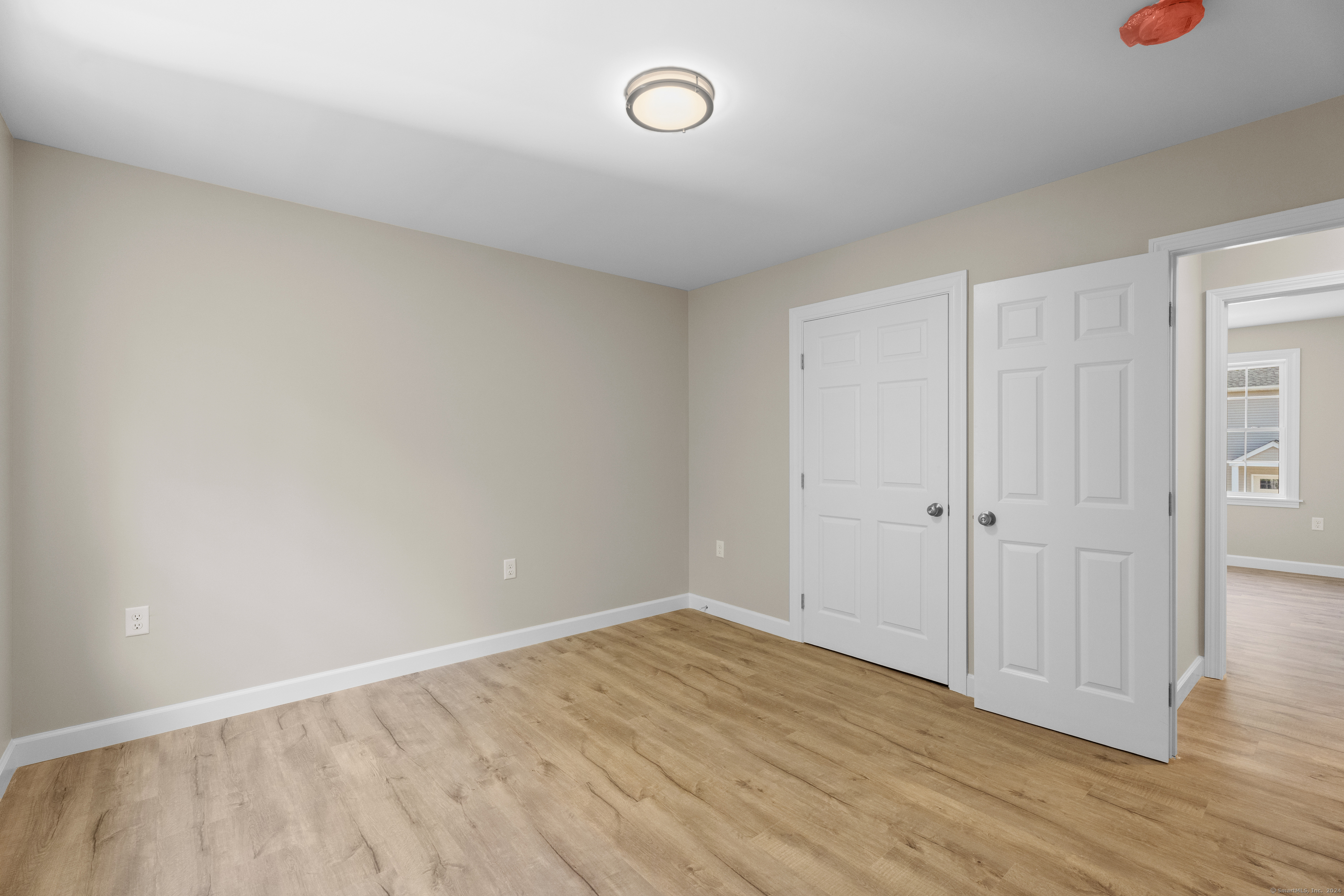 205 Winding Hollow Road Groton, CT 06340 - Photo 12 of 20 a view of an empty room and wooden floor