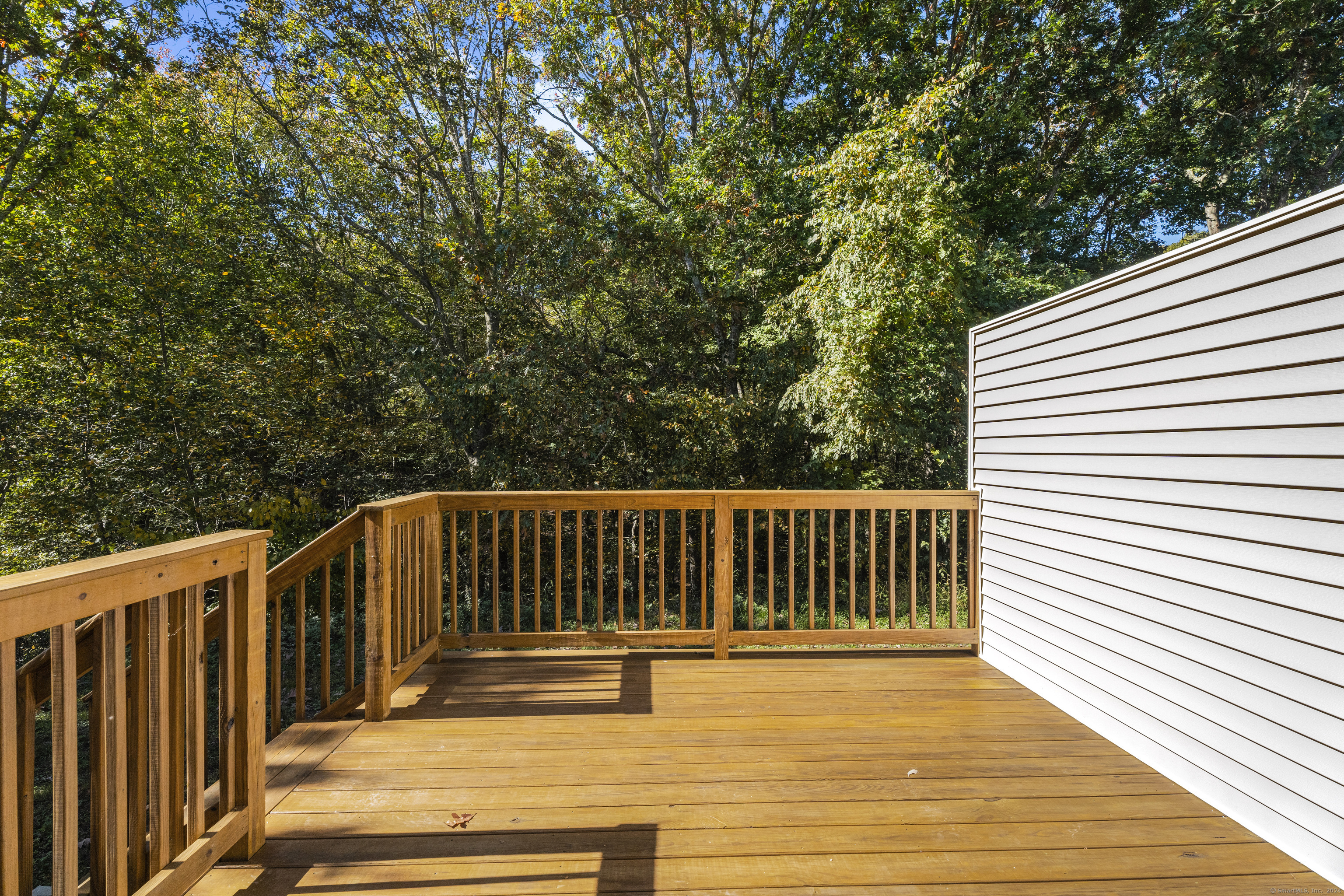205 Winding Hollow Road Groton, CT 06340 - Photo 17 of 20 a view of balcony with wooden floor
