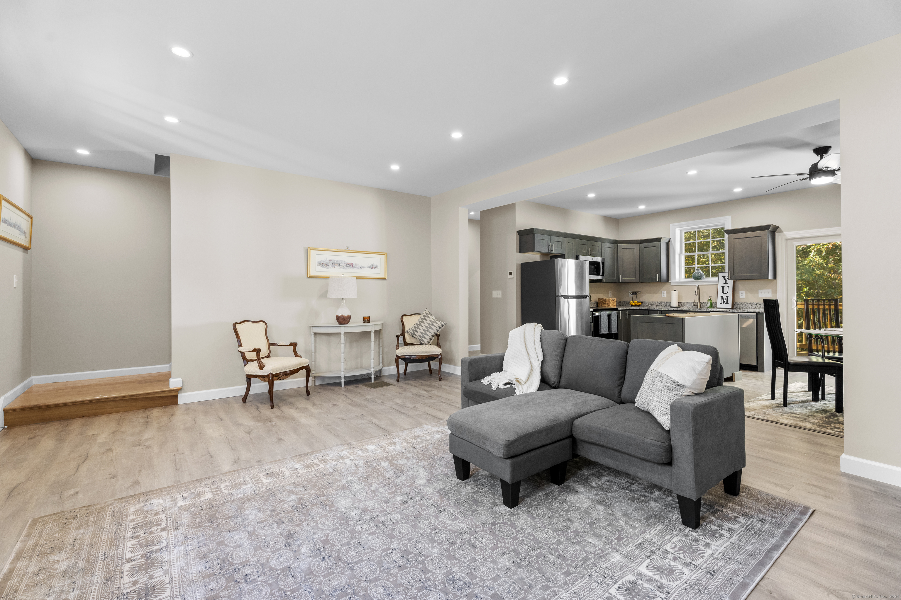 205 Winding Hollow Road Groton, CT 06340 - Photo 3 of 20 a living room with furniture and a table