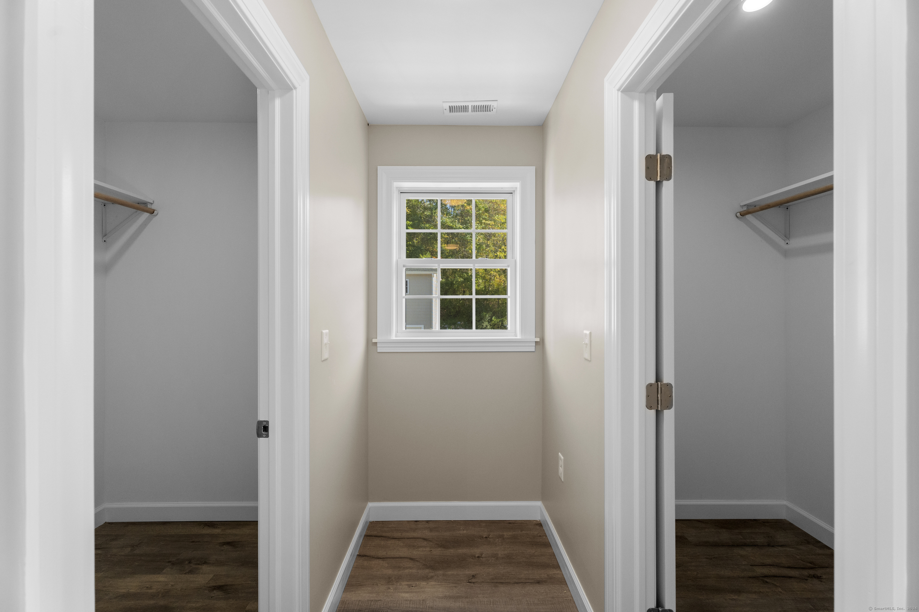 205 Winding Hollow Road Groton, CT 06340 - Photo 8 of 20 a view of hallway with window and hardwood floor